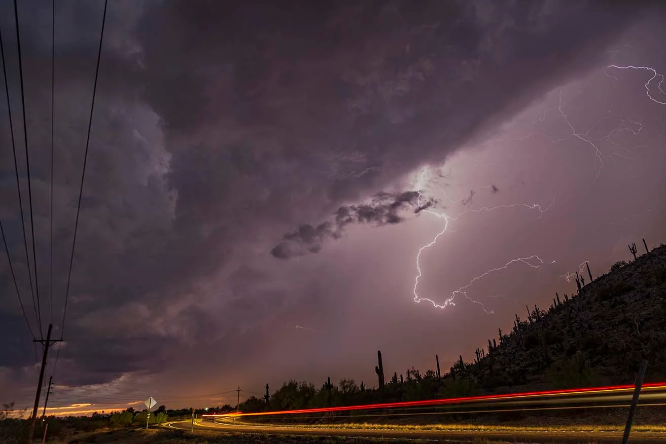 LJ012 Casa Grande Lightning with carlight streaks red Casa Grande Lightning with carlight streaks red, a fine art photograph by Janell Evelyn Baca