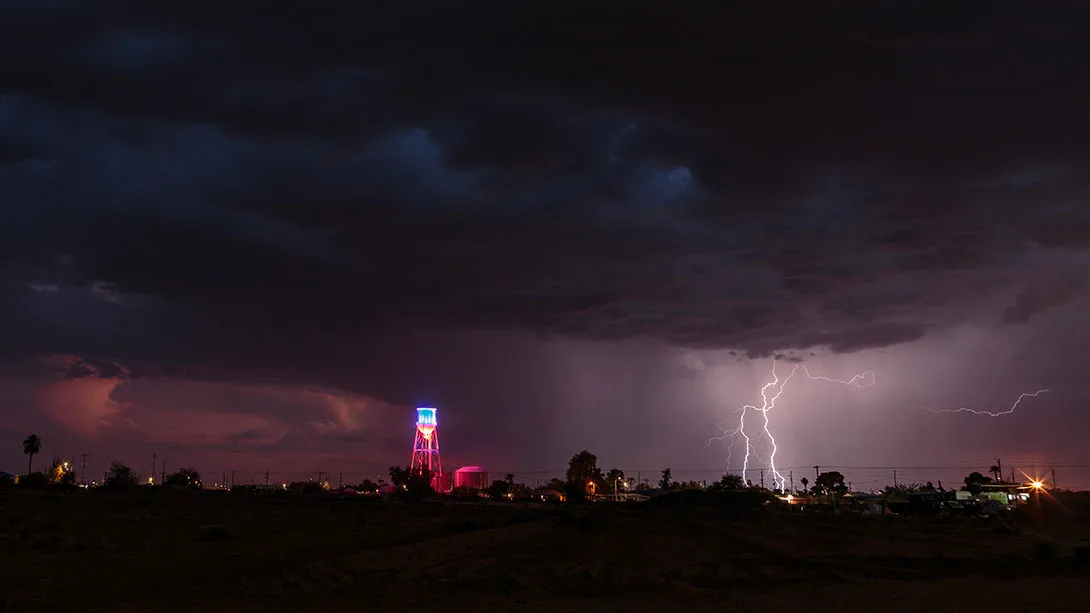 LJ031 Coolidge Water Tower and Lightning Coolidge Water Tower and Lightning, a fine art photograph by Janell Evelyn Baca, Casa de Baca Studios, Florence, Arizona