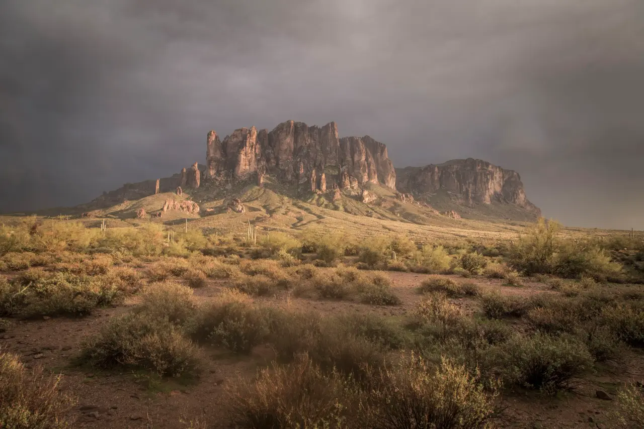 The Superstition Mountains under breaking storm light, fine art photography by Michael Joseph Baca